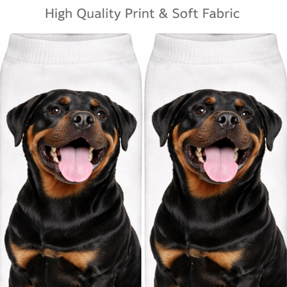 A pair of white crew socks featuring a printed graphic of a Rottweiler dog's face, shown side-by-side with the text 'High Quality Print & Soft Fabric' at the top.