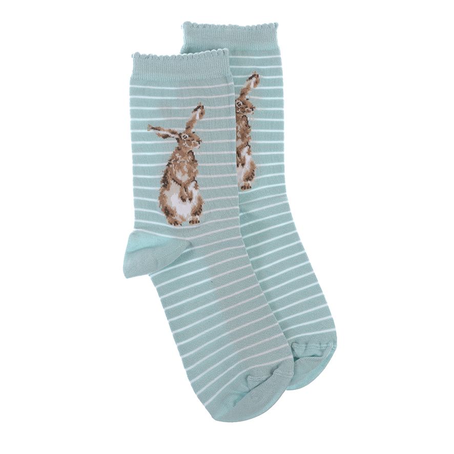 Pair of light blue socks with striped pattern and rabbit design on a white background