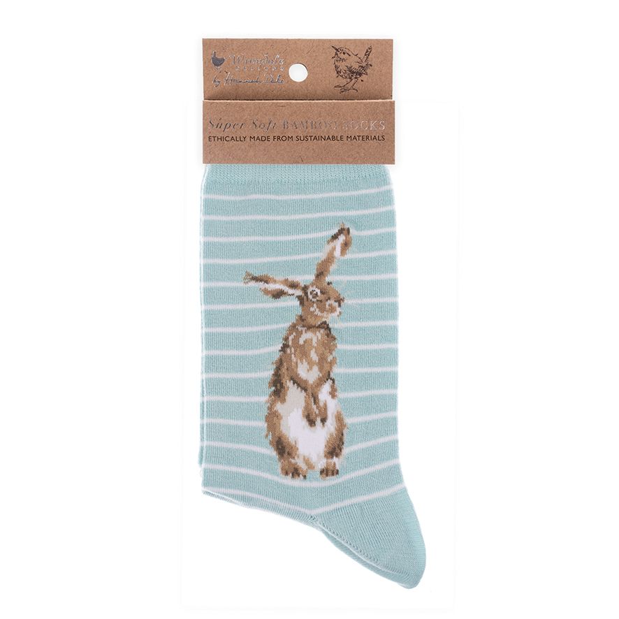 Light blue sock with rabbit design on a white background