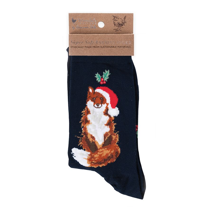 Navy blue sock with a fox wearing a Santa hat and holly leaves, displayed with packaging.