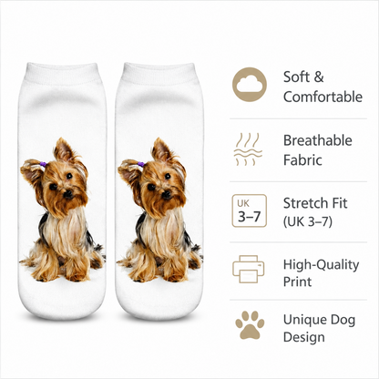 A pair of white ankle socks featuring a printed Yorkshire Terrier design, shown next to a feature list on a white background. The text highlights soft comfort, breathable fabric, stretch fit, high-quality print, and a unique dog design.